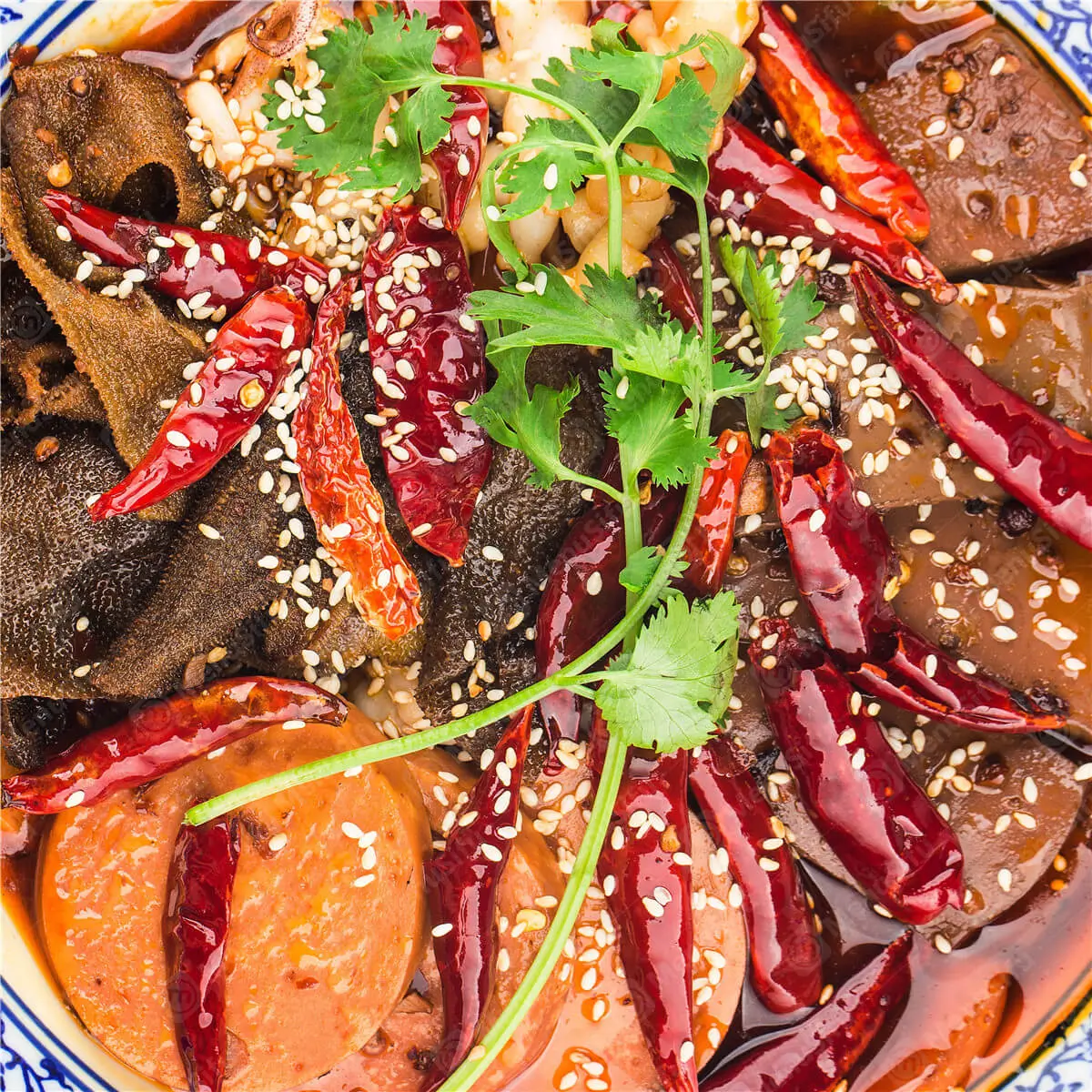 A spicy dish with duck blood, tripe, sausages, chili peppers, and sesame at 成都名堂 SZECHUAN MASTER, a Chinese restaurant in Plano